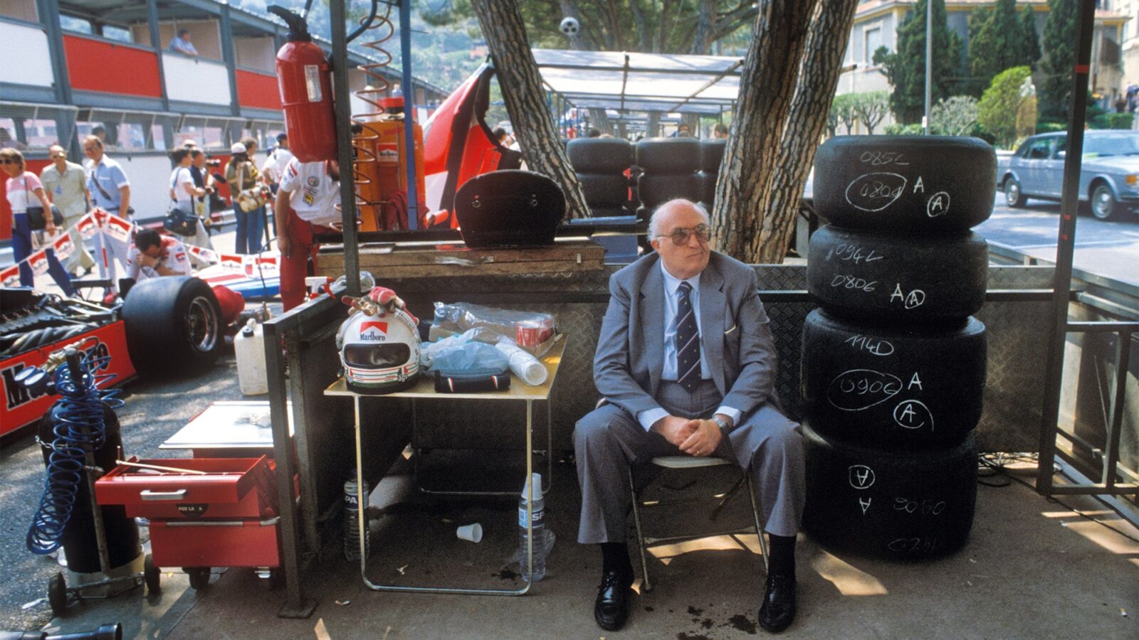 Carlo Chiti sits in the pits at the 1982 Monaco Grand Prix