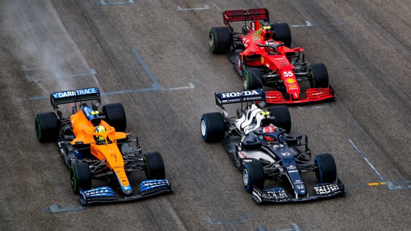 Lando Norris and Carlos Sainz look to pass Pierre Gasly