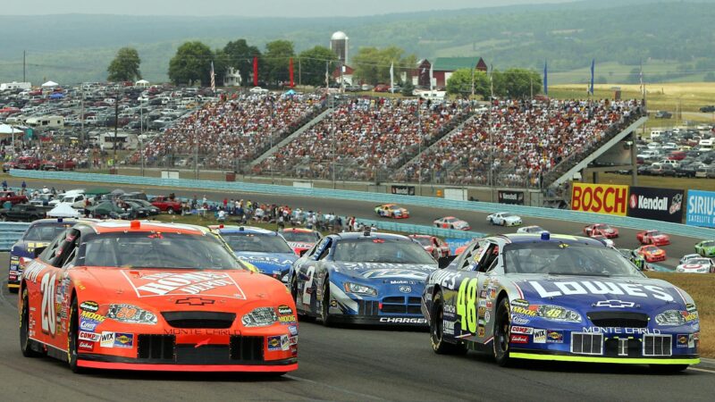 WATKINS GLEN, NY - AUGUST 14: Tony Stewart, driver of the #20 Home Depot Chevrolet, and other drivers gather before the start of the NASCAR Nextel Cup Series Sirius Satellite Radio at the Glen on August 14, 2005 at the Watkins Glen International Raceway in Watkins Glen, New York. (Photo By Streeter Lecka/Getty Images)