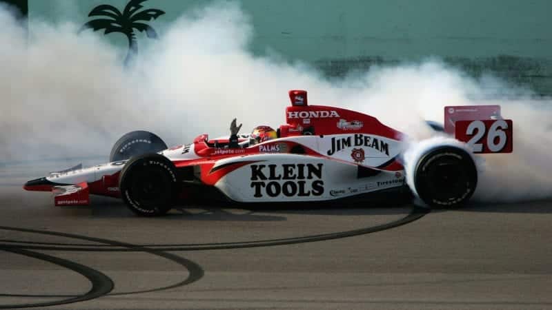 HOMESTEAD, FL - MARCH 6: Dan Wheldon, driver of the #26 Andretti Green Racing Jim Beam Honda Dallara, celebrates his win with victory doughnuts during the IRL IndyCar Series Toyota Indy 300 March 6, 2005 at Homestead-Miami Speedway in Homestead, Florida. (Photo by Jonathan Ferrey/Getty Images)