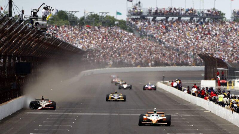 INDIANAPOLIS - MAY 29: Charlie Kimball (R), driver of the #83 Novo Nordisk Chip Ganassi Racing Dallara Honda, crosses the finish line during the IZOD IndyCar Series Indianapolis 500 Mile Race, as JR Hildebrand (left), driver of the #4 National Guard Panther Racing, finishes second after hitting the wall at Indianapolis Motor Speedway on May 29, 2011 in Indianapolis, Indiana. (Photo by Todd Warshaw/Getty Images)