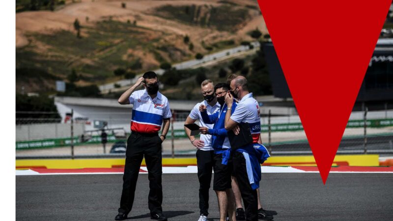 Haas F1's Russian driver Nikita Mazepin (2ndL) walks with team members at the Algarve International Circuit in Portimao on April 29, 2021 ahead of the Portuguese Formula One Grand Prix. (Photo by PATRICIA DE MELO MOREIRA / AFP) (Photo by PATRICIA DE MELO MOREIRA/AFP via Getty Images)