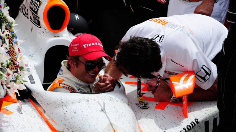 INDIANAPOLIS, IN - MAY 29: Dan Wheldon of England, driver of the #98 William Rast-Curb/Big Machine Dallara Honda, is congratulated by a teammate in victory lane after winning the IZOD IndyCar Series Indianapolis 500 Mile Race at Indianapolis Motor Speedway on May 29, 2011 in Indianapolis, Indiana. (Photo by Robert Laberge/Getty Images)