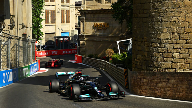 BAKU, AZERBAIJAN - JUNE 06: Lewis Hamilton of Great Britain driving the (44) Mercedes AMG Petronas F1 Team Mercedes W12 leads Charles Leclerc of Monaco driving the (16) Scuderia Ferrari SF21 during the F1 Grand Prix of Azerbaijan at Baku City Circuit on June 06, 2021 in Baku, Azerbaijan. (Photo by Dan Mullan - Formula 1/Formula 1 via Getty Images)