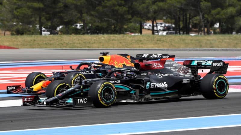 Lewis Hamilton passes Max Verstappen at the start of the 2021 French Grand Prix