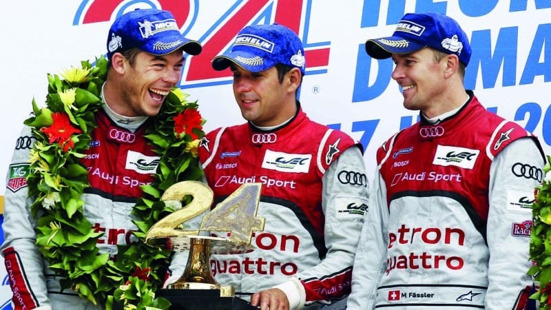 Andre Lotterer Benoit Treluyer and Marcel Fassler on Le Mans podium in 2012