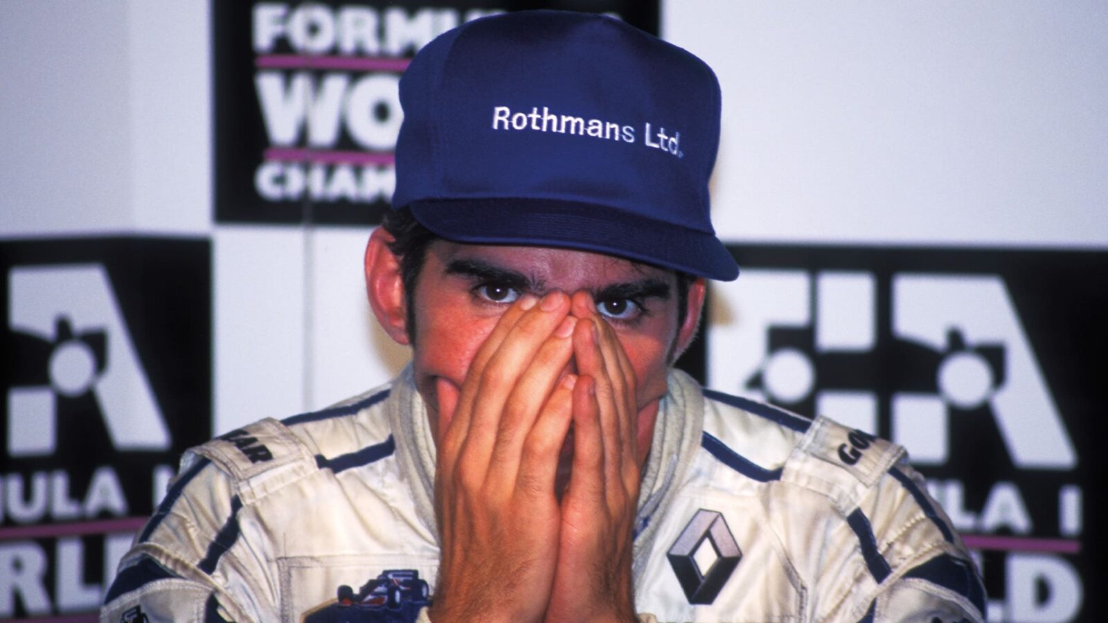 Damon Hill with head in his hands in 1996