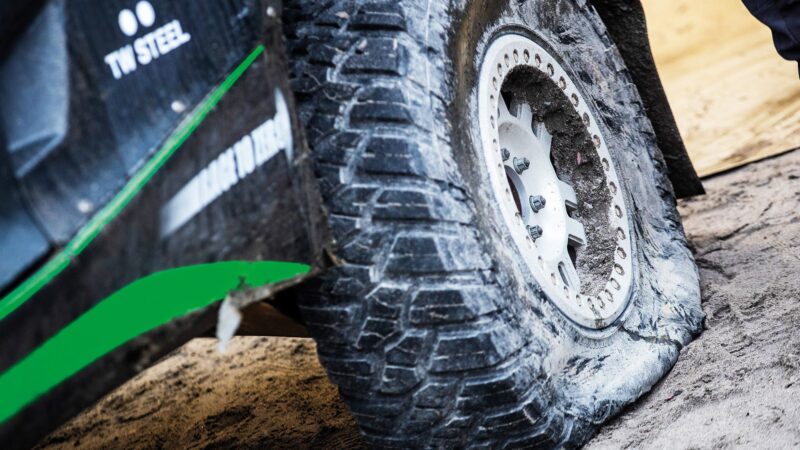 Punctured Extreme E car tyre