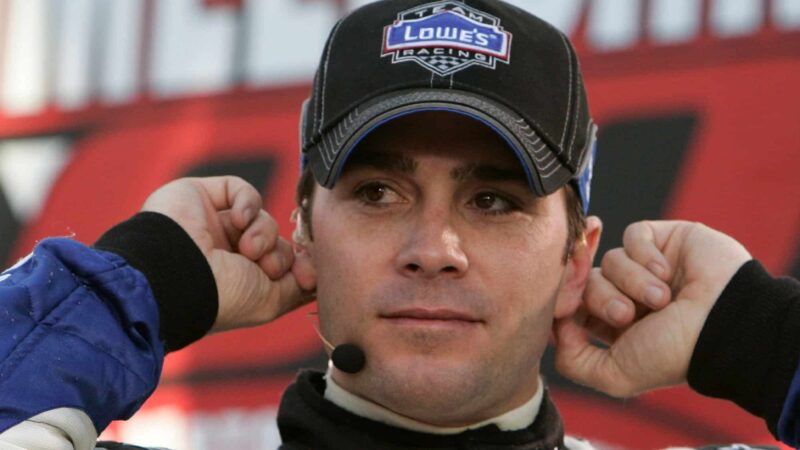 Jimmie Johnosn adjusts his head set getting ready for an interview with Speed, at the Las Vegas Motor Speedway. Jimmie Johnson won the race for the second year in a row. Johnson beat Matt Kenseth by a fraction of a second. (Photo by Warren Wimmer/Getty Images)