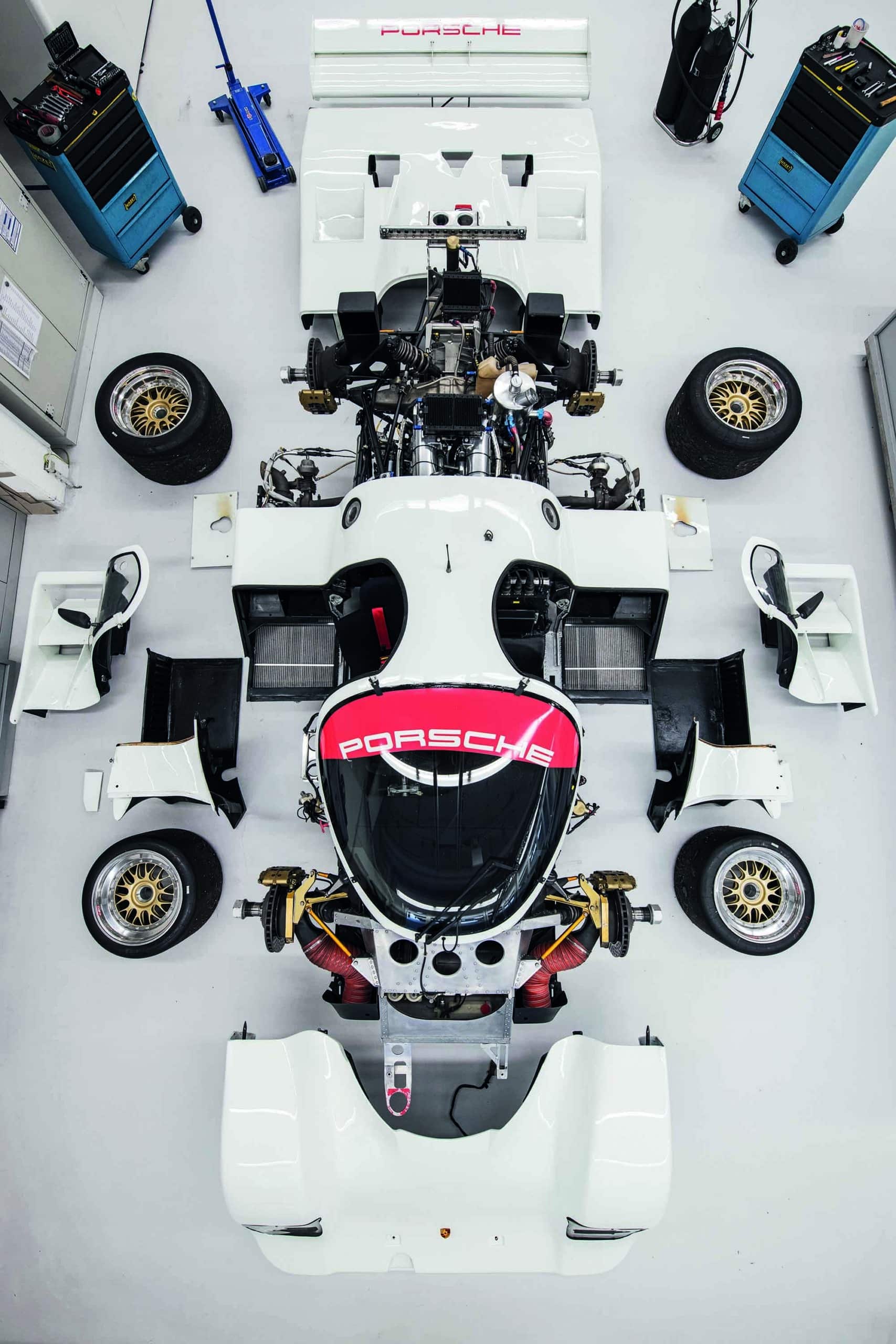 Porsche 962 parts arranged in shape of car