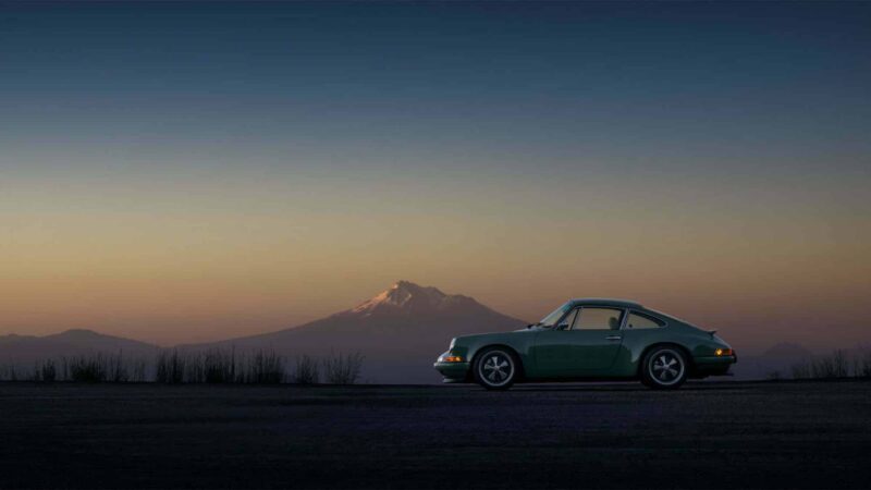 Porsche 911 with mountain in background