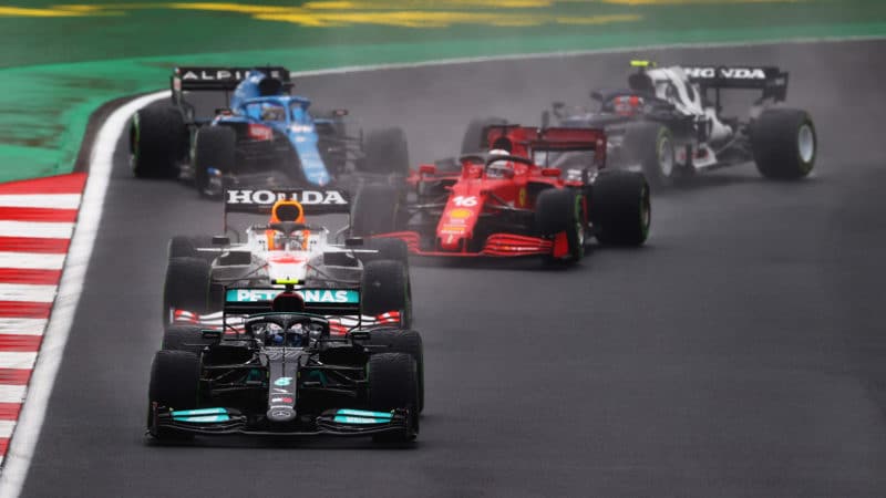 Valtteri Bottas leads and Fernando Alonso spins at the start of the 2021 Turkish Grand Prix
