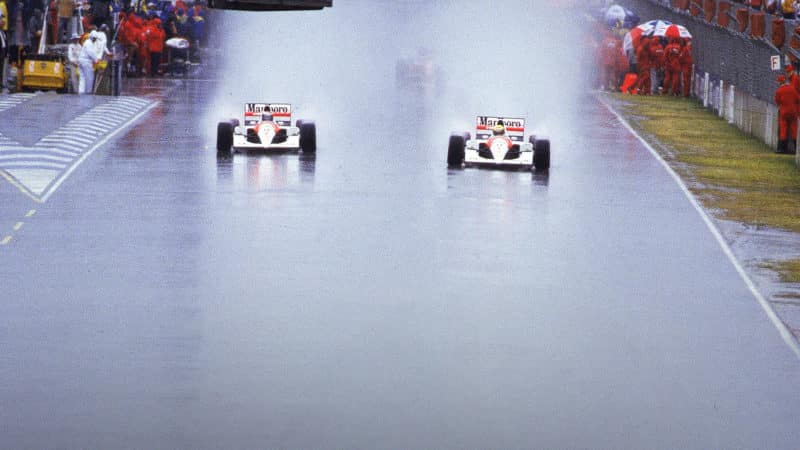 Ayrton Senna alongside Alain Prost in the rain at the 1989 Australian Grand Prix