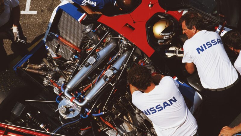 Overhead view of Nissan R89C as Keith Greene leans in to talk to Julian Bailey