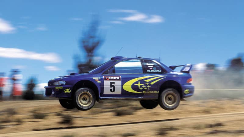 Subaru of Richard Burns in mid air jump at 1999 Australian Rally