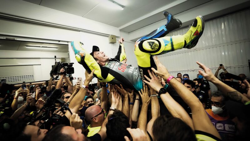 Valenino Rossi is lifted into the air by his team after his last race