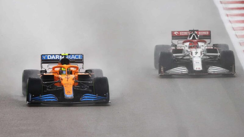 SOCHI, RUSSIA - SEPTEMBER 26: Lando Norris of Great Britain driving the (4) McLaren F1 Team MCL35M Mercedes and Kimi Raikkonen of Finland driving the (7) Alfa Romeo Racing C41 Ferrari during the F1 Grand Prix of Russia at Sochi Autodrom on September 26, 2021 in Sochi, Russia. (Photo by Bryn Lennon/Getty Images)