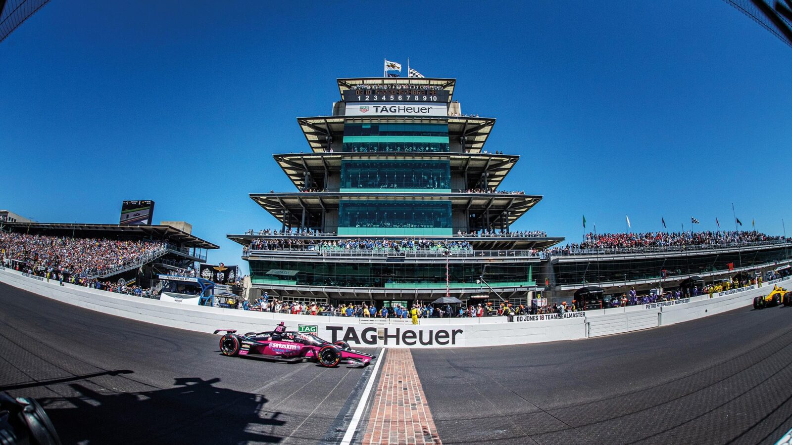 Helio Castroneves crosses the finish line to win the 2021 Indy 500