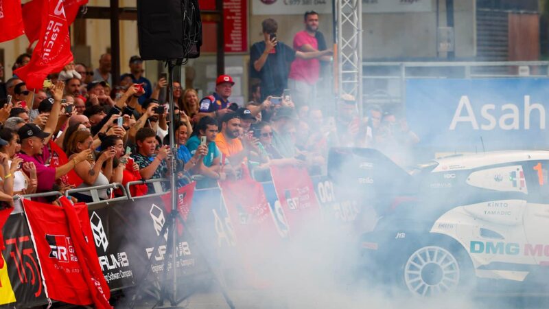 A cloud of tyre smoke around the WRC Toyota of Sebastien Ogier as he performs donuts