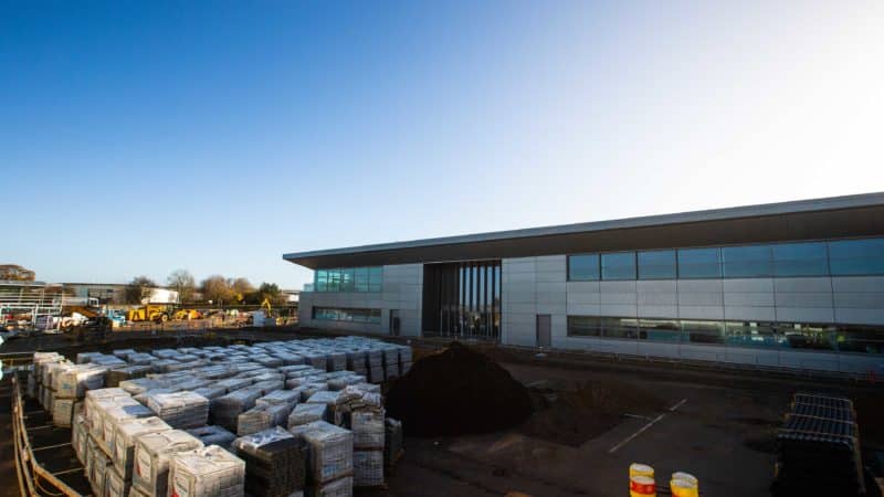Building materials outside new Aston Martin F1 factory