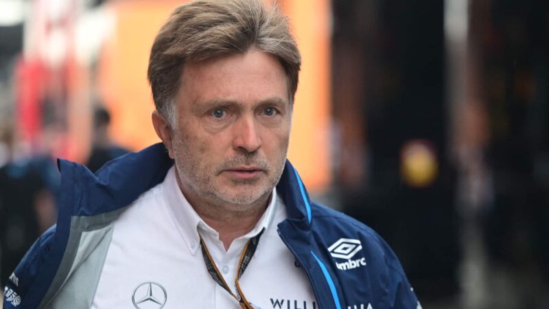 Jost Capito walks along the F1 pitlane