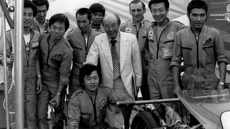 Soichiro Honda with Motorcycle Grand Prix Honda mechanics at Brands Hatch in 1980