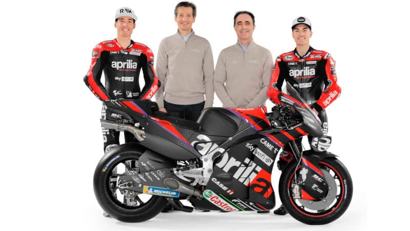 2022 Aprilia team of Pol Espargaro Maverick Vinales Romano Albesiano and Massimo Rivolawith MotoGP bike