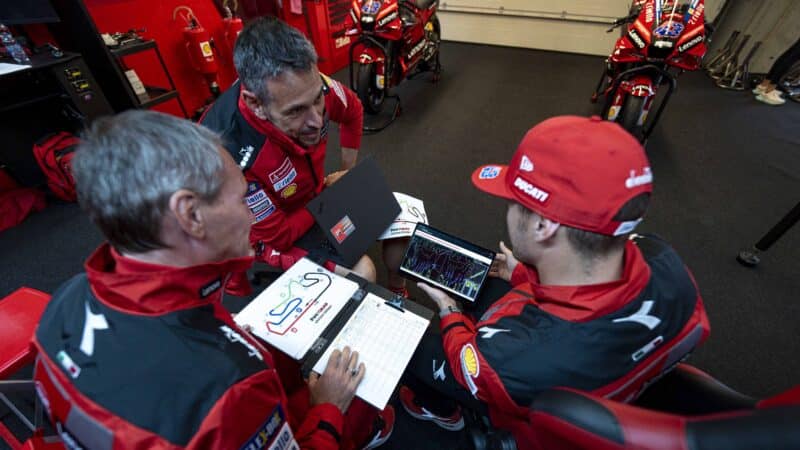 Cristhian Pupulin and Jack Miller debrief with telemetry in Ducati MotoGP garage