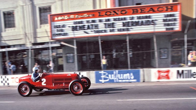 Hill-in-a-932-Alfa-Romeo-driving-past-cinema