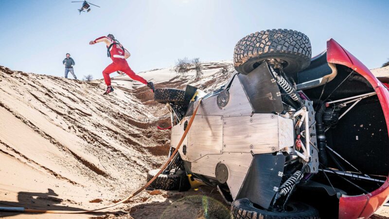 Sébastien Loeb leaps out of car