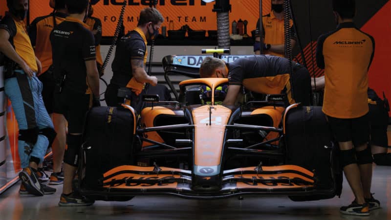 McLaren f1 car being worked on in garage