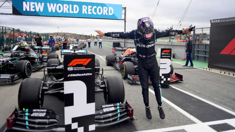 Lewis Hamilton leaps out of his Mercedes in parc ferme after winning 2020 F1 Portuguese Grand Prix