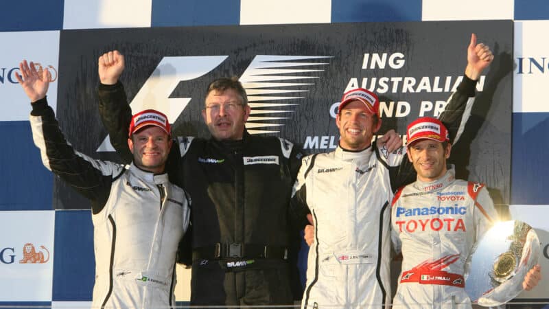 2009 Australian Grand Prix podiu: Brawn's Jenson Button and Rubens Barrichello joined by team principal Ross Brawn