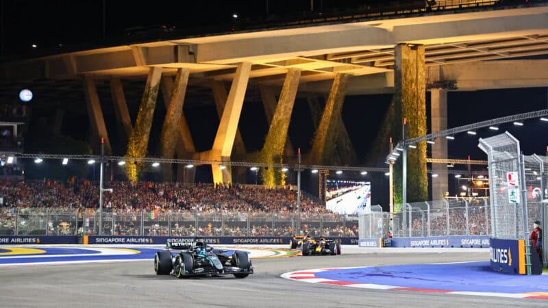 Geoprge Russell (Mercedes) leads Max Verstappen (Red Bull-Honda) during the 2025 Singapore Grand Prix