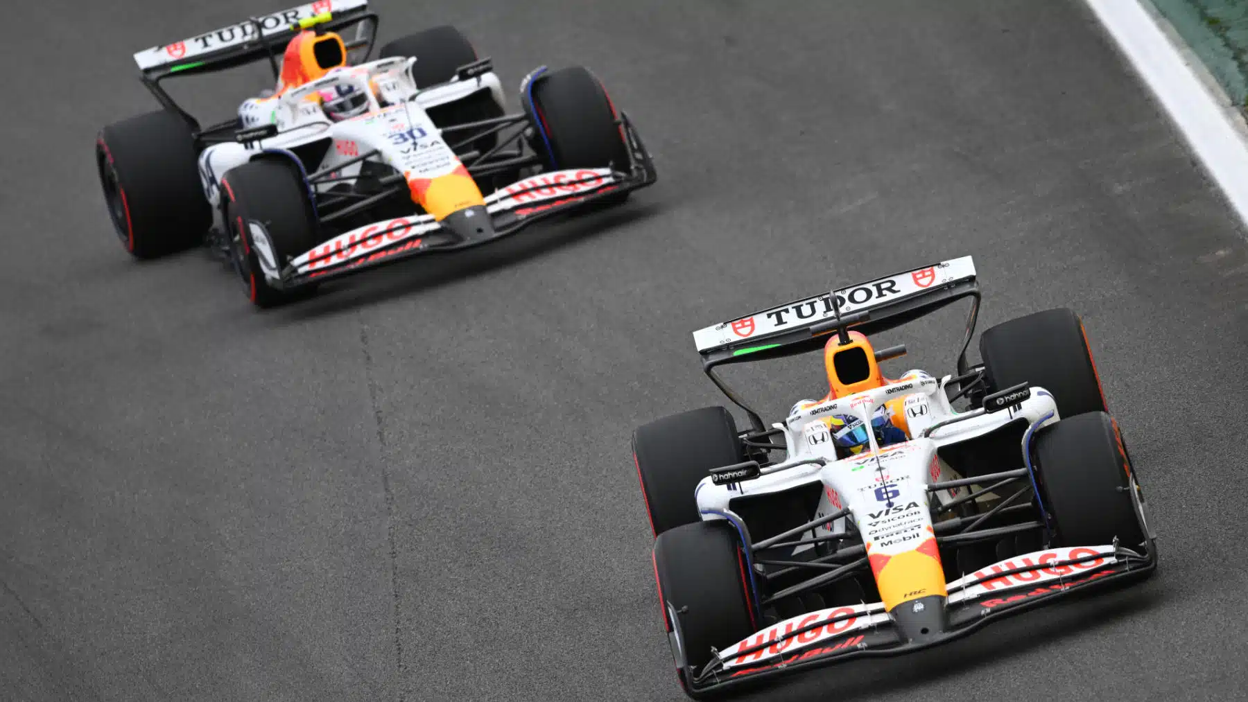 Isack Hadjar ahead of Liam Lawson during the Brazilian Grand Prix