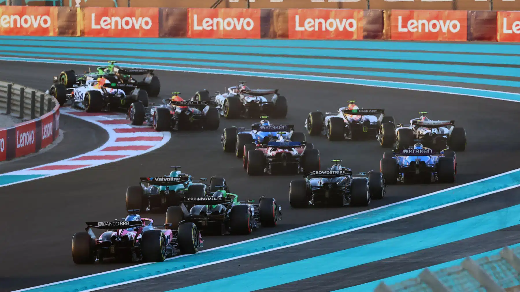 The field seen from behind in the second corner after the start of the 2025 Abu Dhabi Grand Prix