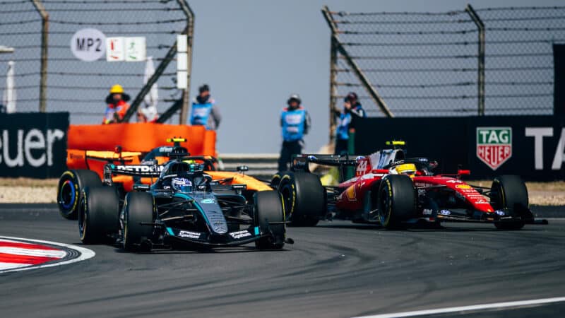 George Russell (Mercedes) leads Lewis Hamilton (Ferrari) and Lando Norris (McLaren-Mercedes) at the start of the sprint race before the 2026 Chinese Grand Prix