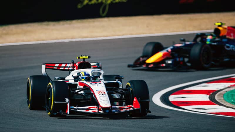 Oliver Bearman (Haas-Ferrari) leads Isack Hadjar (Red Bull-Ford) in the sprint race before the 2026 Chinese Grand Prix