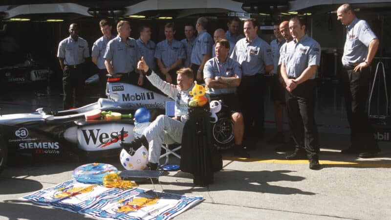 McLaren-Mercedes team with David Coulthard celebrate Mika Hakkinen´s sabbatical before the 2001 Japanese Grand Prix