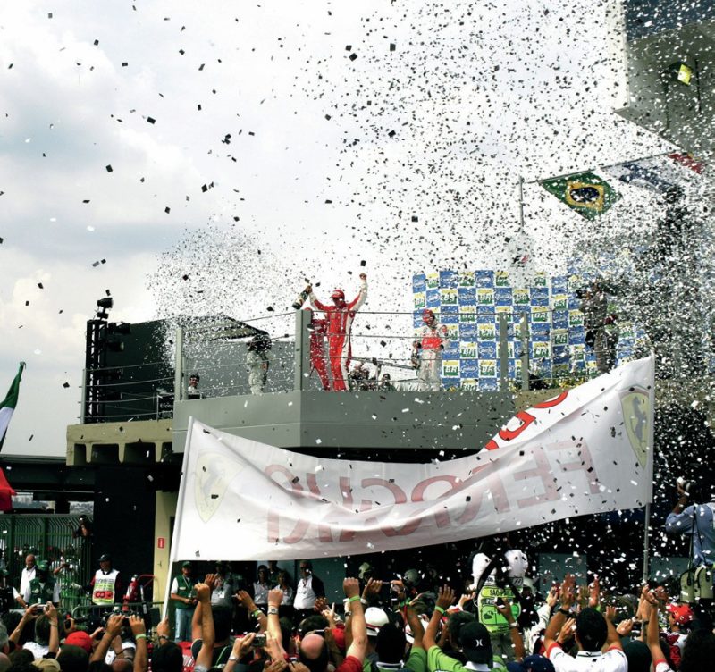 Kimi Raikkonen celebrates winning the 2007 Brazilian Grand Prix and the World Championship